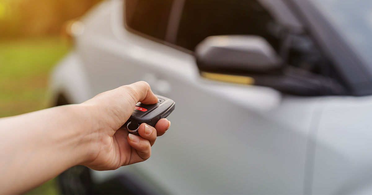 Holding key fob to car
