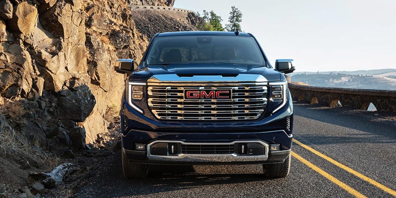 Blue 2022 GMC Sierra Denali Ultimate in the desert