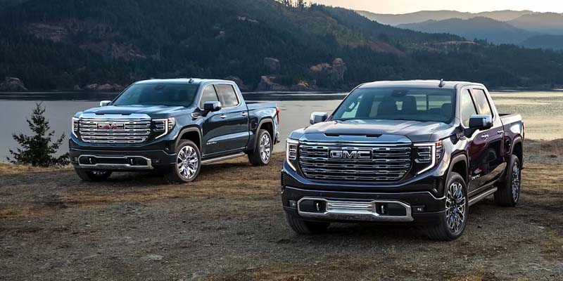 Two 2023 GMC Sierra 1500's in mountains