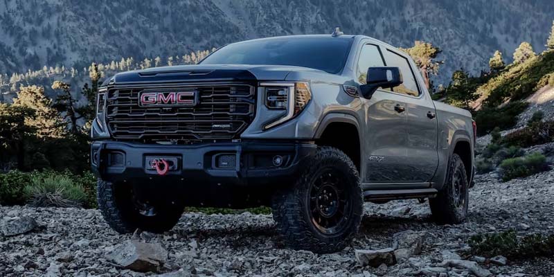 White 2023 GMC Sierra 1500 in mountains